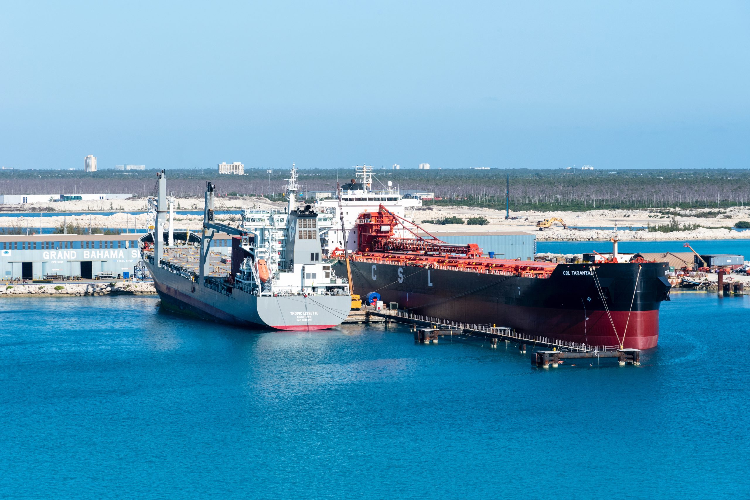 Freeport, Bahamas - cargo ships berthed in the sea port.